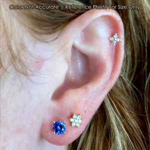 yellow gold round brilliant tanzanite studs on ear size