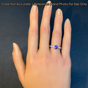 diamond and tanzanite gemstone ring on hand