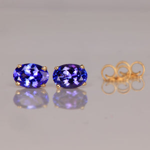 oval cut tanzanite stud earrings yellow gold
