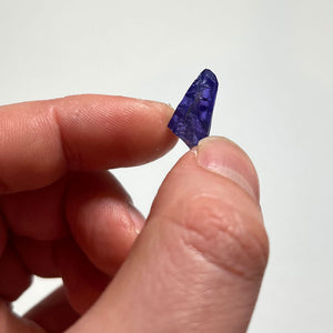 deep blue violet tanzanite in hand
