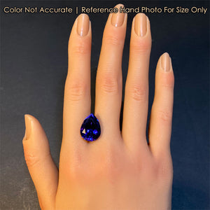 tanzanite gem on hand for size
