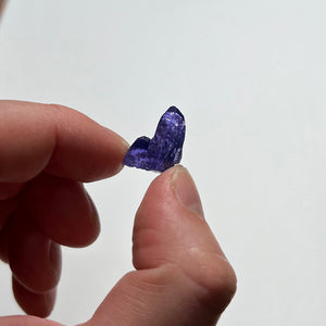 mineral specimen of tanzanite in hand