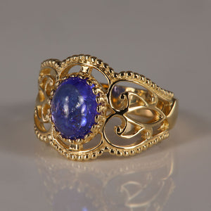 tanzanite and gold ring oval cabochon cut