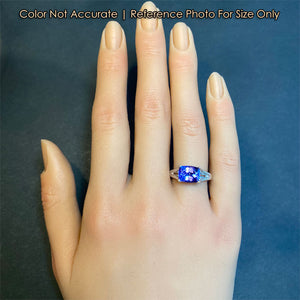 white gold tanzanite gemstone ring on hand