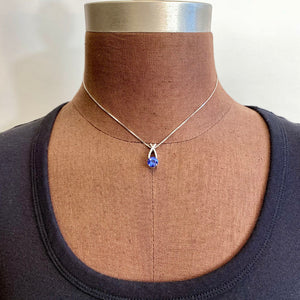 tanzanite and diamond pendant in white gold