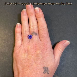 round brilliant tanzanite gem size on hand