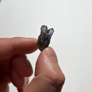 double terminated tanzanite in hand