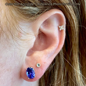 oval tanzanite gemstone earrings on ear