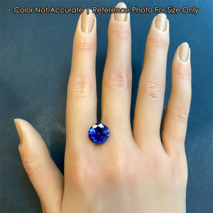 tanzanite gem on hand round brilliant blue color