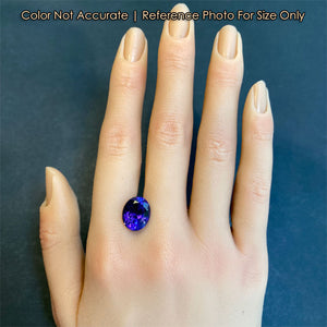 size of violet oval tanzanite to hand
