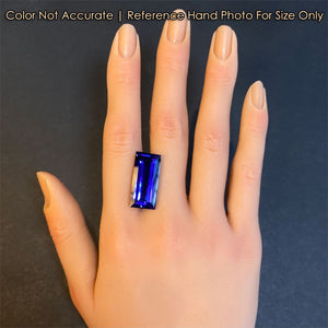 emerald baguette tanzanite gem on hand