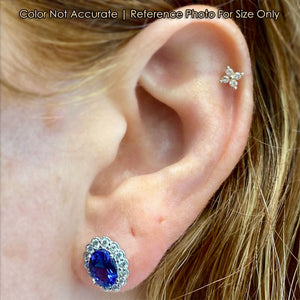 size of oval tanzanite and diamond studs on ear