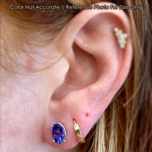 oval tanzanites on ear