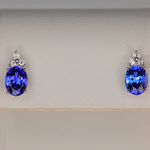 violet blue tanzanite gemstones oval cut with diamonds in white gold earrings