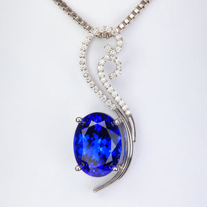 blue oval tanzanite pendant with diamonds white gold