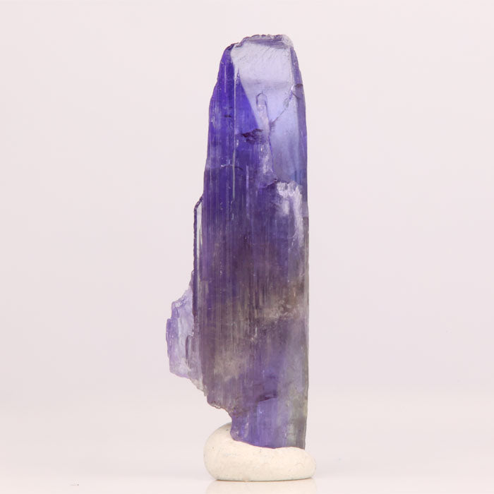 Raw natural purple tanzanite crystal specimen