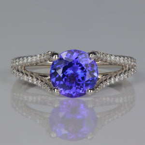 round brilliant tanzanite gemstone ring in white gold with diamonds