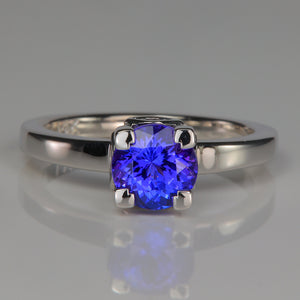 white gold tanzanite and peekaboo diamond accents ring