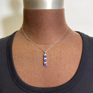white gold and tanzanite pendant with diamonds