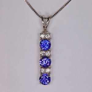 tanzanite and diamond pendant in white gold