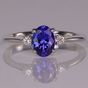 one carat oval tanzanite gemstone ring with diamonds