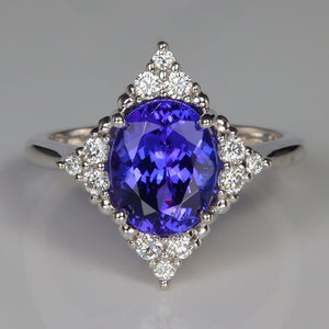 Oval tanzanite gemstone in white gold ring with diamonds