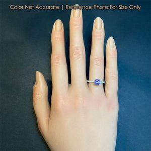 white gold dainty tanzanite and diamond ring