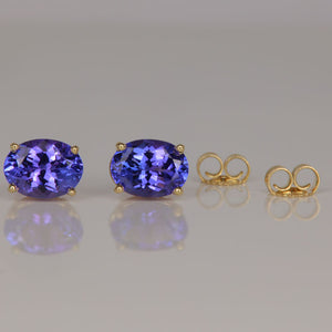 oval tanzanite stud earrings in yellow gold