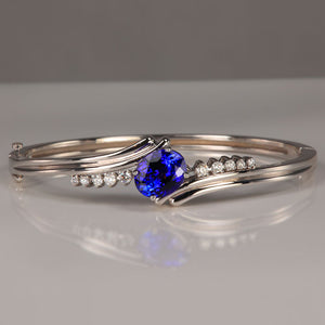oval cut tanzanite in white gold bracelet with diamonds