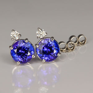 round brilliant tanzanite gemstone earrings with diamonds in white gold