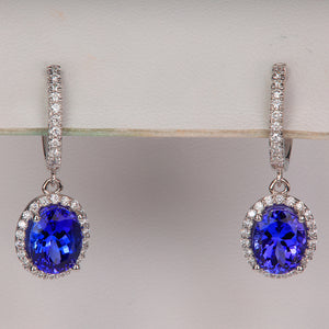 blue violet tanzanite gemstone earrings with diamond in white gold