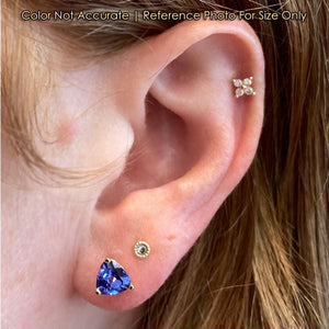 tanzanite stud earrings in yellow gold