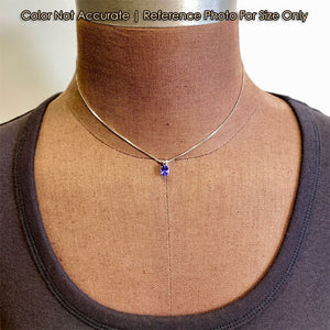 size reference of tanzanite and white gold pendant on form