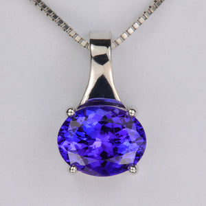 blue violet oval cut tanzanite and white gold pendant