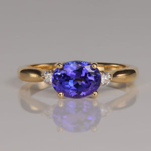 oval blue violet tanzanite gemstone ring in yellow gold