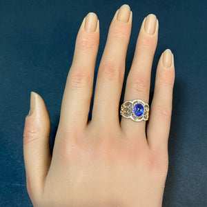 oval cabochon tanzanite blue violet in yellow gold on hand