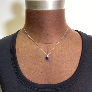 emerald cut tanzanite pendant with diamond white gold