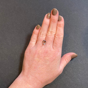 fancy peach pink oval tanzanite