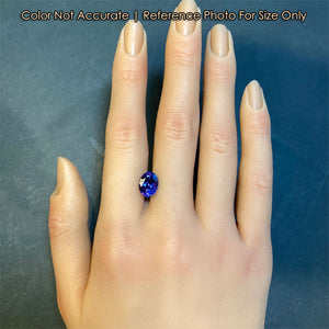 violet blue tanzanite gemstone size to hand