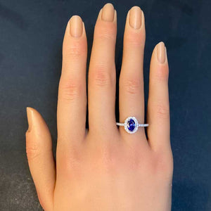 tanzanite ring with diamonds on hand