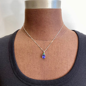 oval tanzanite and pear tsavorite garnet pendant white gold