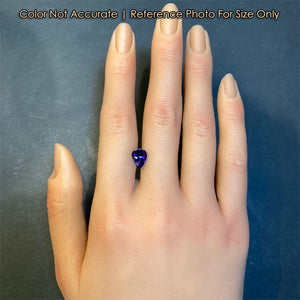 size of pear tanzanite to hand