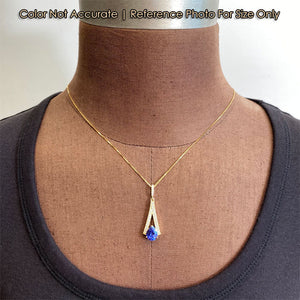 yellow gold tanzanite and diamond pendant on a bust form