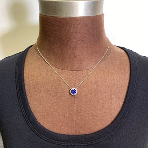 round tanzanite platinum diamond pendant