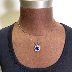 trilliant tanzanite round diamond setting white gold