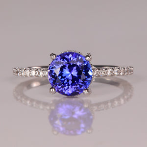 blue violet tanzanite round brilliant cut  gemstone ring with diamonds