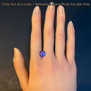 tanzanite gemstone on hand round brilliant cut