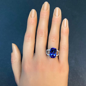 white gold tanzanite ring with diamonds on hand