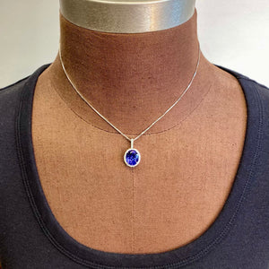 oval tanzanite and diamond pendant white gold