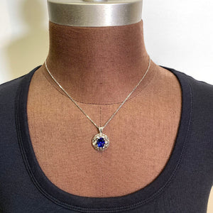 oval tanzanite pendant white gold baguette diamonds